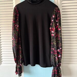 Pretty black blouse with sheer flowered sleeves. Size small